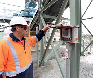 Quarry manager Shane Toto at the small control box of the automated new plant that replaces the traditional row of buttons.