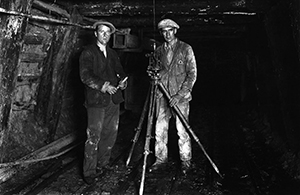 Photographer and miner Joseph Divis and mine manager Tas Hogg surveying the old Blackwater mine with assistant Nick Brett (left). Behind Nick’s shoulder is the ventilation shaft. (Pic: Ministry for Culture and Heritage.)