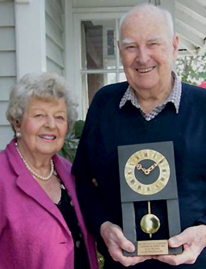 Bryan Bartley and his wife Elaine with the Caernarfon Trophy he received in 1989 from the IoQ for his paper, “High Density Autogeneous Crushing”.