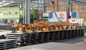 Real Steel’s Magnet Beam, an electromagnet used for lifting thin plate up to 10 metres long. It is fully remote-controlled and has the ability to turn plate.