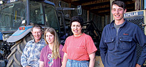 The Adlam family (from left) – Andrew, daughter Hannah, Jill and son William – in front of some equipment at their Bell Block home just outside New Plymouth.
